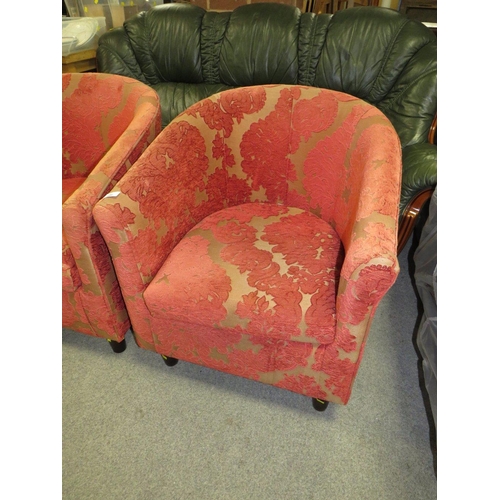 786 - A pair of modern red patterned upholstered tub style armchairs