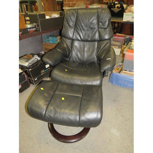 788 - A black leather stressless (Ekornes) armchair and footstool