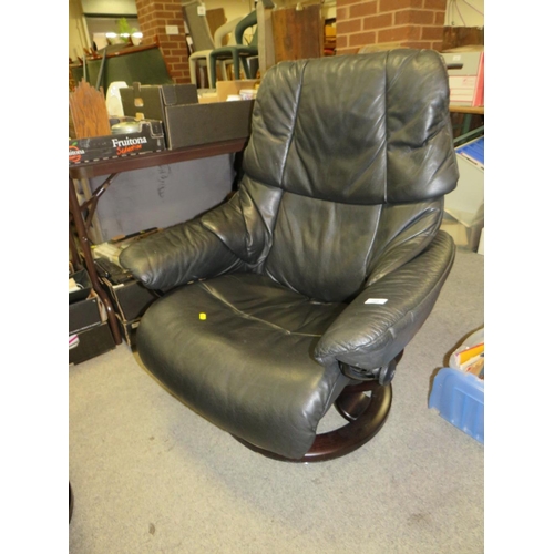 788 - A black leather stressless (Ekornes) armchair and footstool