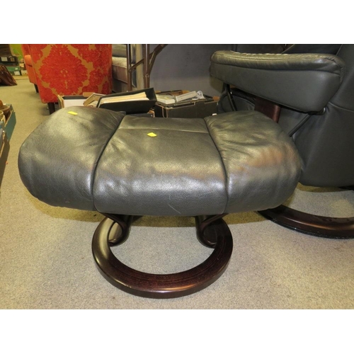 788 - A black leather stressless (Ekornes) armchair and footstool