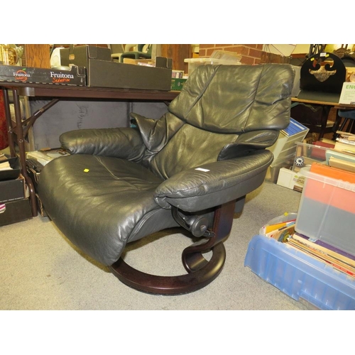 788 - A black leather stressless (Ekornes) armchair and footstool