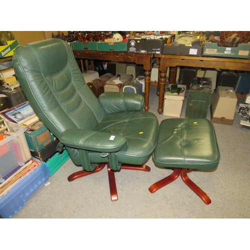 789 - A modern green Stressless style armchair and footstool