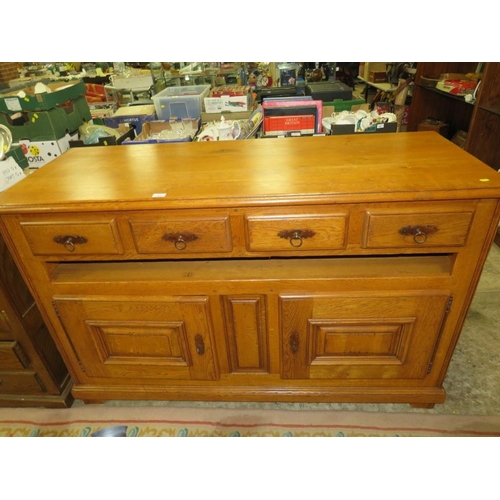 792 - A small oak two door cabinet with two drawers below