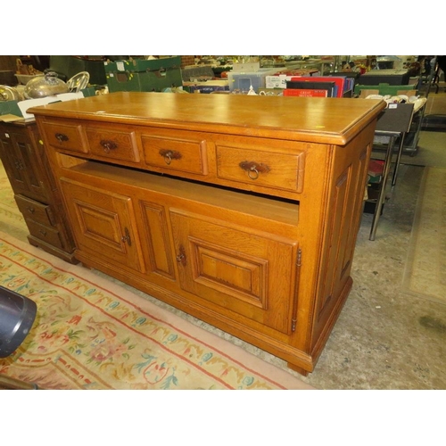 792 - A small oak two door cabinet with two drawers below