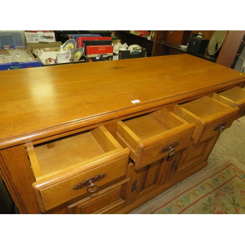 792 - A small oak two door cabinet with two drawers below