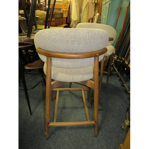 801 - A pair of harlequin upholstered bar/kitchen stools