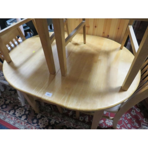 805 - A modern beech style kitchen table and four chairs