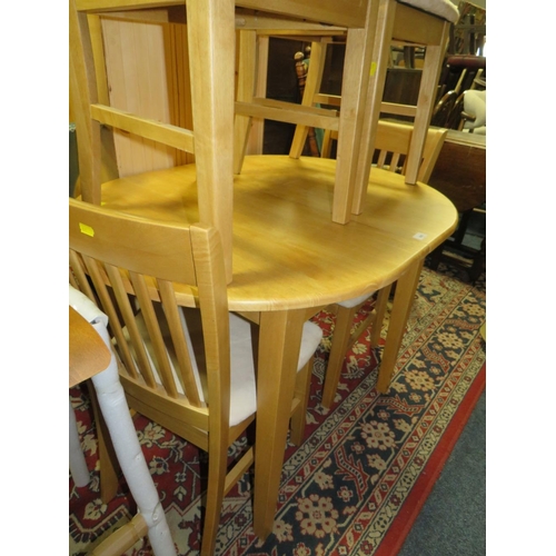 805 - A modern beech style kitchen table and four chairs