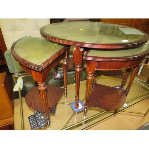 815 - A modern mahogany circular nest of tables