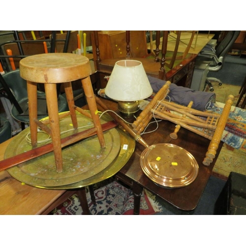 824 - A woollen rug, a hanging tapestry, a brass top table, warming pan, lamp, stool, etc.