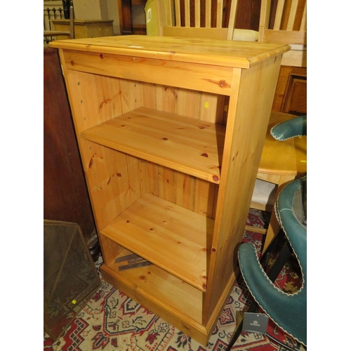 827 - A modern open, honey pine bookcase W 65 cm