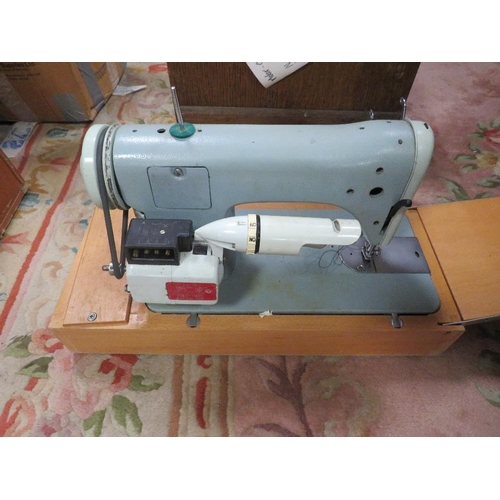 83 - FOUR ASSORTED SEWING MACHINES TOGETHER WITH AN OVERLOCK MACHINE - ALL AS FOUND