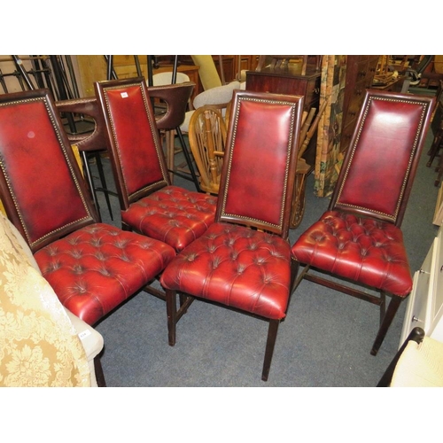 833 - A set of four mahogany reproduction oxblood, red dining chairs