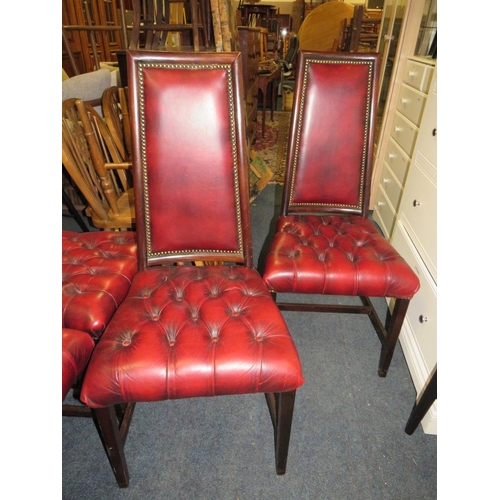 833 - A set of four mahogany reproduction oxblood, red dining chairs