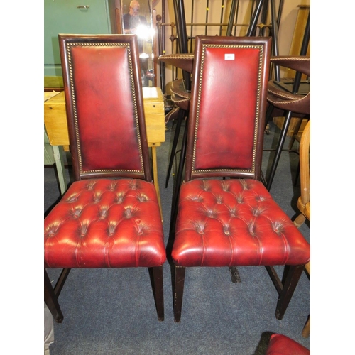 833 - A set of four mahogany reproduction oxblood, red dining chairs