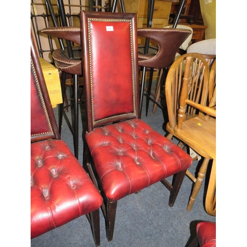 833 - A set of four mahogany reproduction oxblood, red dining chairs