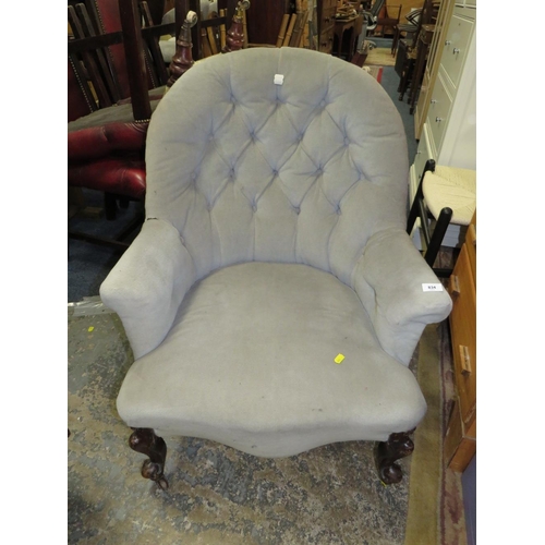 834 - A Victorian mahogany upholstered armchair