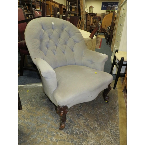 834 - A Victorian mahogany upholstered armchair