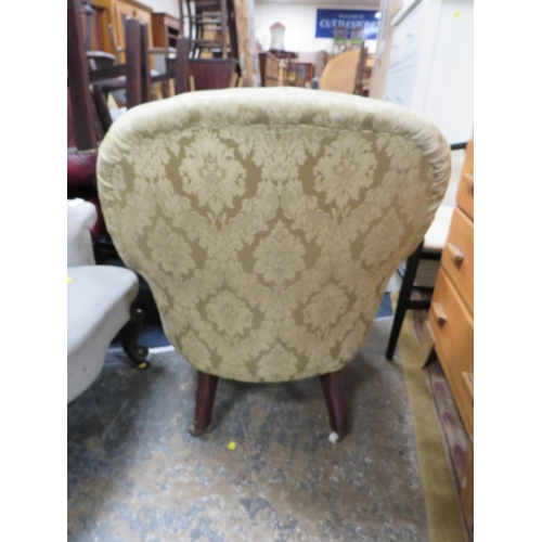 835 - An Edwardian mahogany upholstered armchair