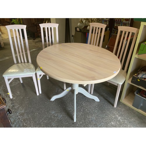 840 - A modern limed style circular, extending dining table and four chairs