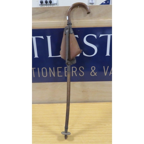 253 - AN ANTIQUE SHOOTING STICK