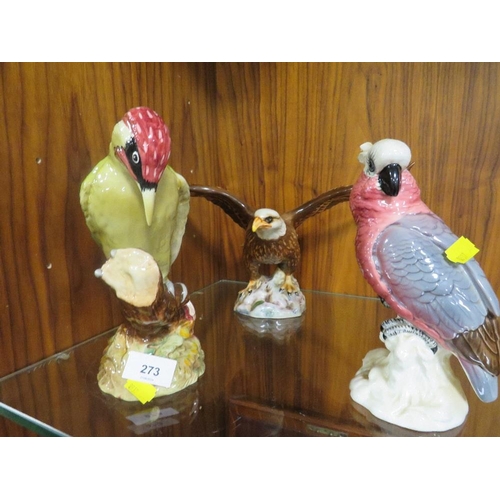 273 - A BESWICK WOODPECKER TOGETHER WITH A BESWICK BALD EAGLE AND COCKATOO A/F (3)