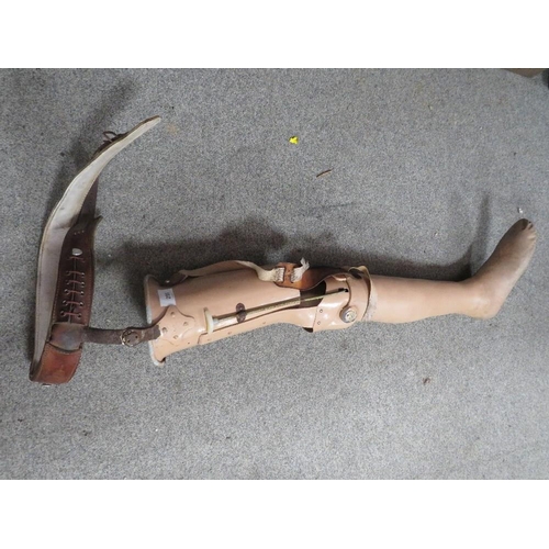 295 - A VINTAGE PROSTHETIC LEG WITH LEATHER WAIST BELT FITTING