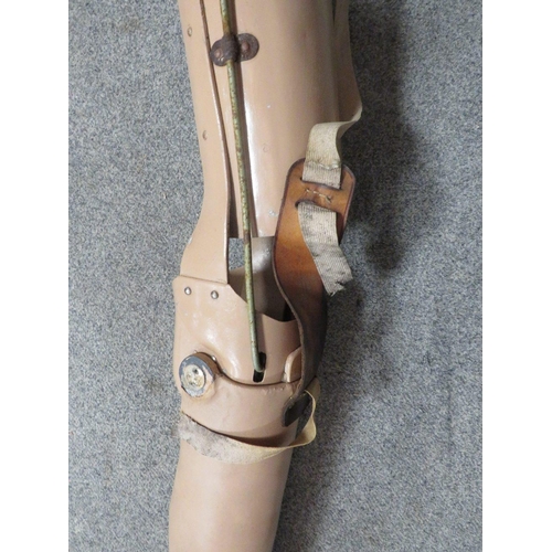 295 - A VINTAGE PROSTHETIC LEG WITH LEATHER WAIST BELT FITTING