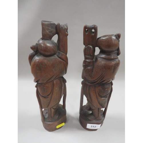 312 - A PAIR OF ORIENTAL STYLE CARVED HARDWOOD FIGURES