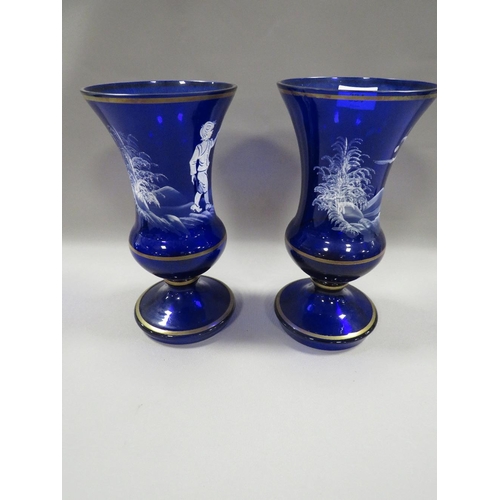 334 - A PAIR OF BLUE GLASS MARY GREGORY STYLE VASES