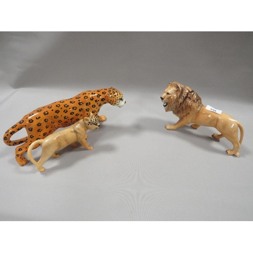 338 - A BESWICK FIGURE OF A LION, A LEOPARD AND ANOTHER (3)