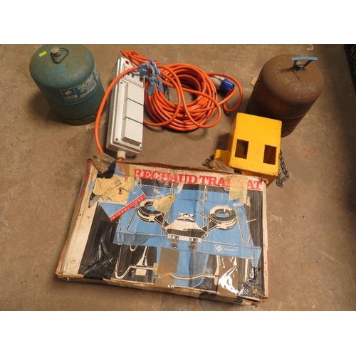 655 - A BOX GAS CAMPING STOVE, TWO GAS BOTTLES, A CARAVAN HITCH LOCK AND A CARAVN ELECTRIC HOOK UP LEAD