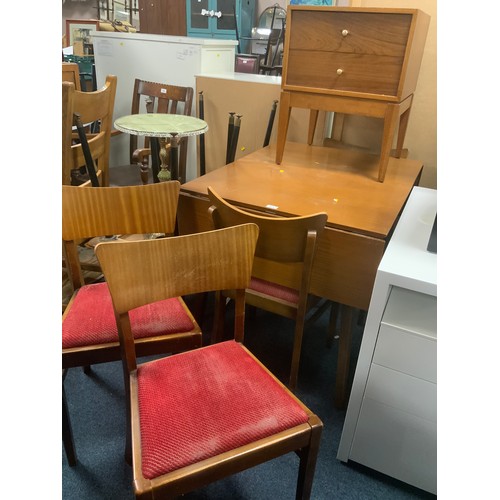 873 - A mid-century teak drop leaf dining table with four chairs and two drawer cabinet