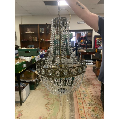 877 - A large empire style crystal and metal modern chandelier