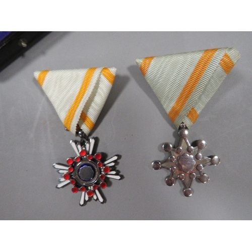 470 - TWO JAPANESE MILITARY MEDALS, ORDER OF THE SACRED TREASURE 5th & 6th CLASSES IN FITTED CASES (2)