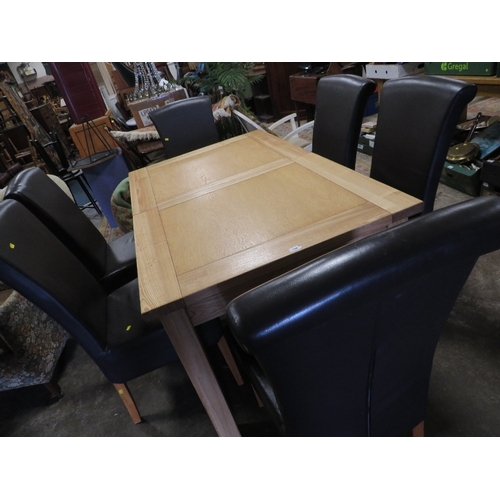 839 - A modern light oak, extending dining table and six leather style dining chairs