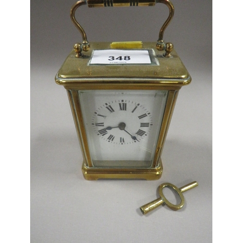 348 - A CARRIAGE CLOCK WITH KEY