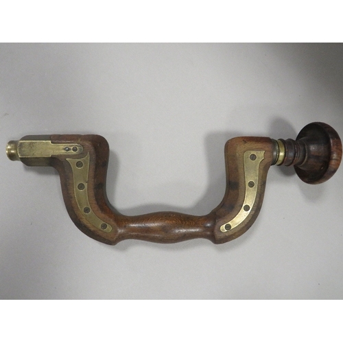 383 - AN ANTIQUE BRASS MOUNTED CARPENTERS BRACE