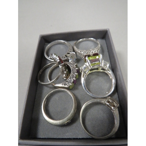 402 - SIX HALLMARKED SILVER DRESS RINGS TOGETHER WITH ONE WHITE METAL DRESS RING (7)