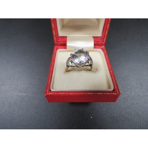 404 - A LARGE SOLITAIRE RING MARKED 9ct