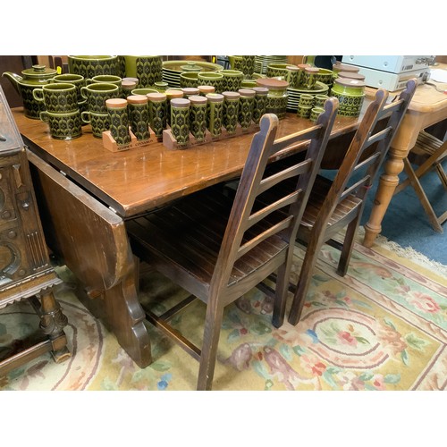 836 - An oak refectory style dining table and four chairs