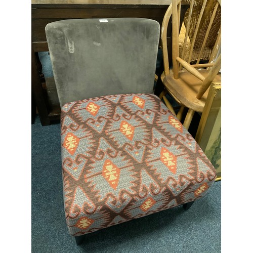 830 - A modern low upholstered bedroom chair