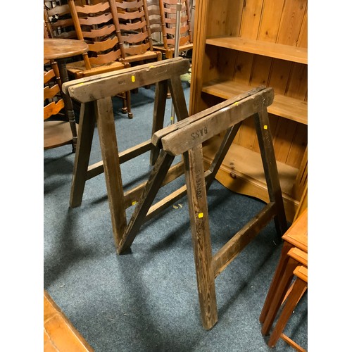 816 - A pair of vintage wooden trestles stamped ‘Bass’