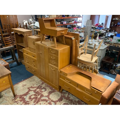 812 - A mid-century utility oak tallboy and dressing table, chest of drawers, and two smaller cabinets