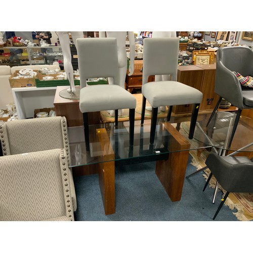 801 - A modern glass top rectangular dining table with two upholstered chairs