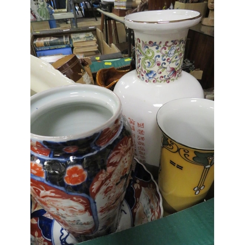 106 - A tray of assorted ceramics to include an Oriental vase, treacle glazed style jug etc.