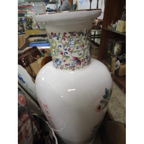 106 - A tray of assorted ceramics to include an Oriental vase, treacle glazed style jug etc.