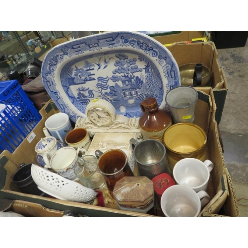 112 - Three trays of assorted ceramics to include plates, Staffordshire style spaniels etc