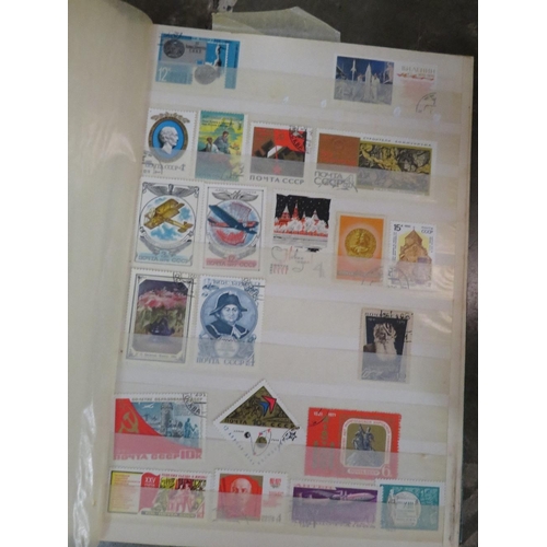 133 - Two albums of world stamps, large quantity of loose stamps, together with two albums of first day co... 