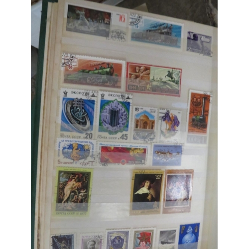 133 - Two albums of world stamps, large quantity of loose stamps, together with two albums of first day co... 